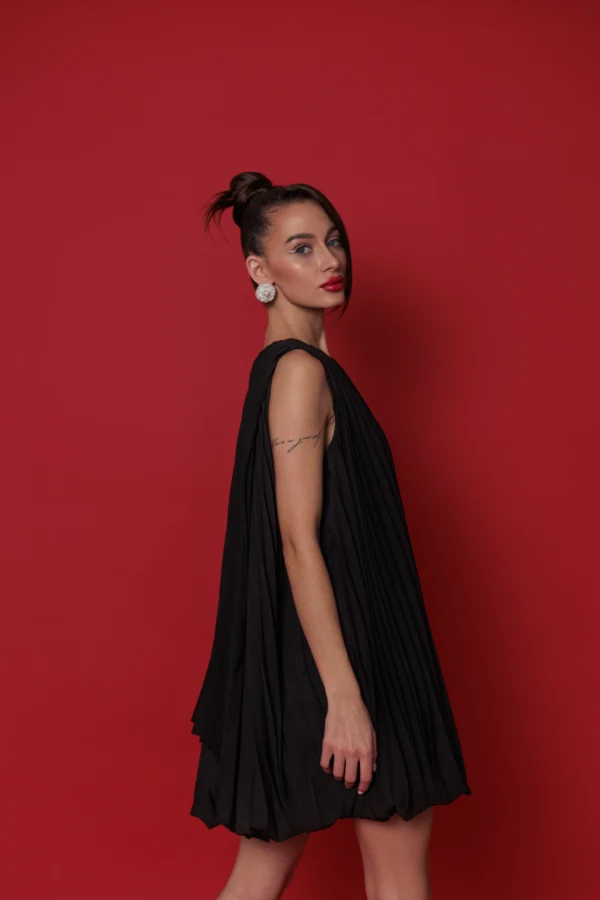 Modern designer mini dress with signature bubble hem by REPULO’S