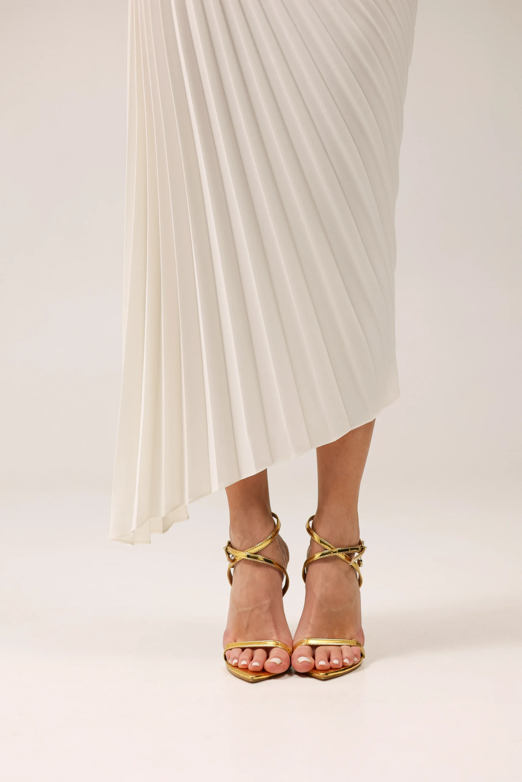 Premium pleated skirt with architectural asymmetrical silhouette by REPULO’S