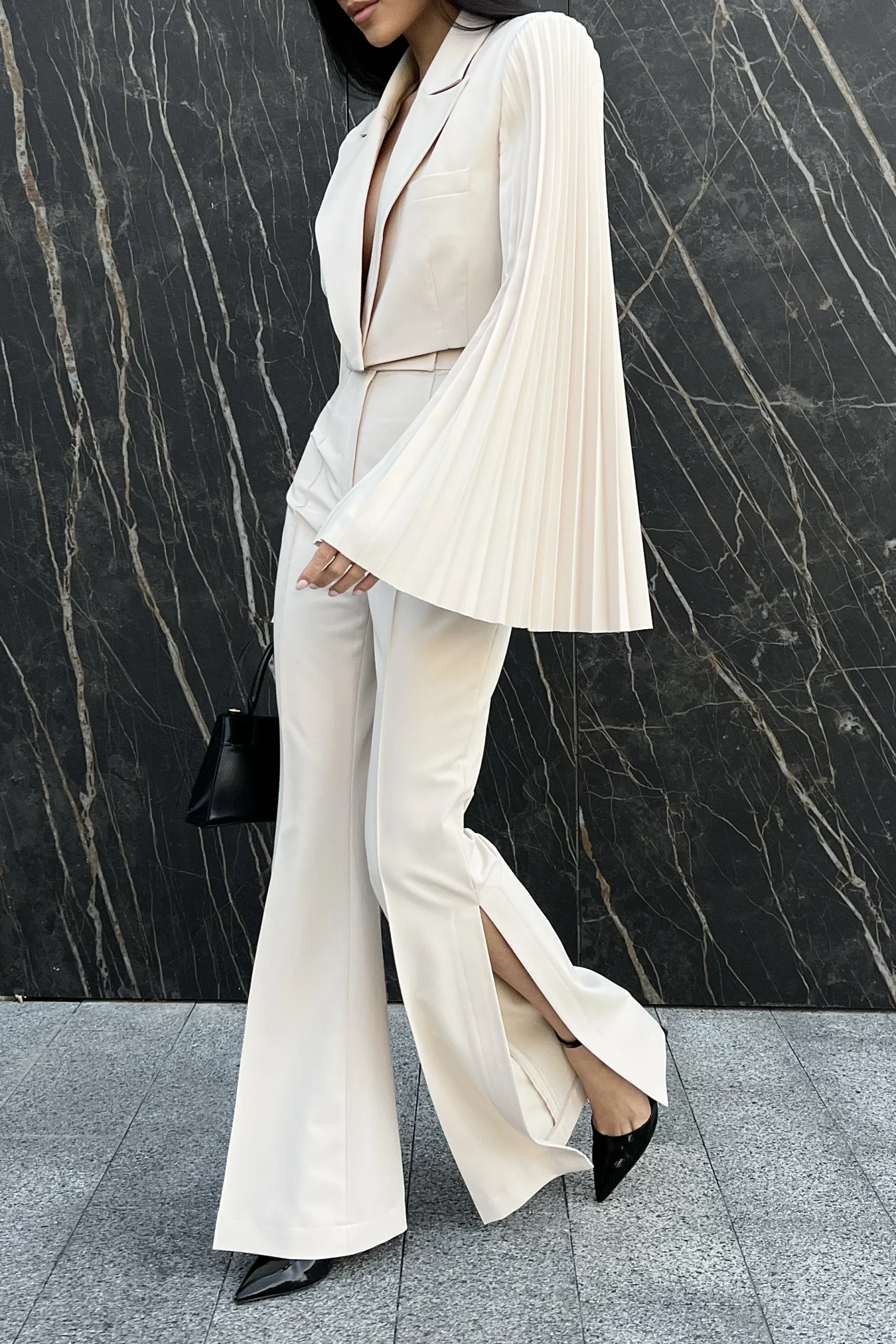 Luxury statement trousers with knee-high side slits by REPULO’S