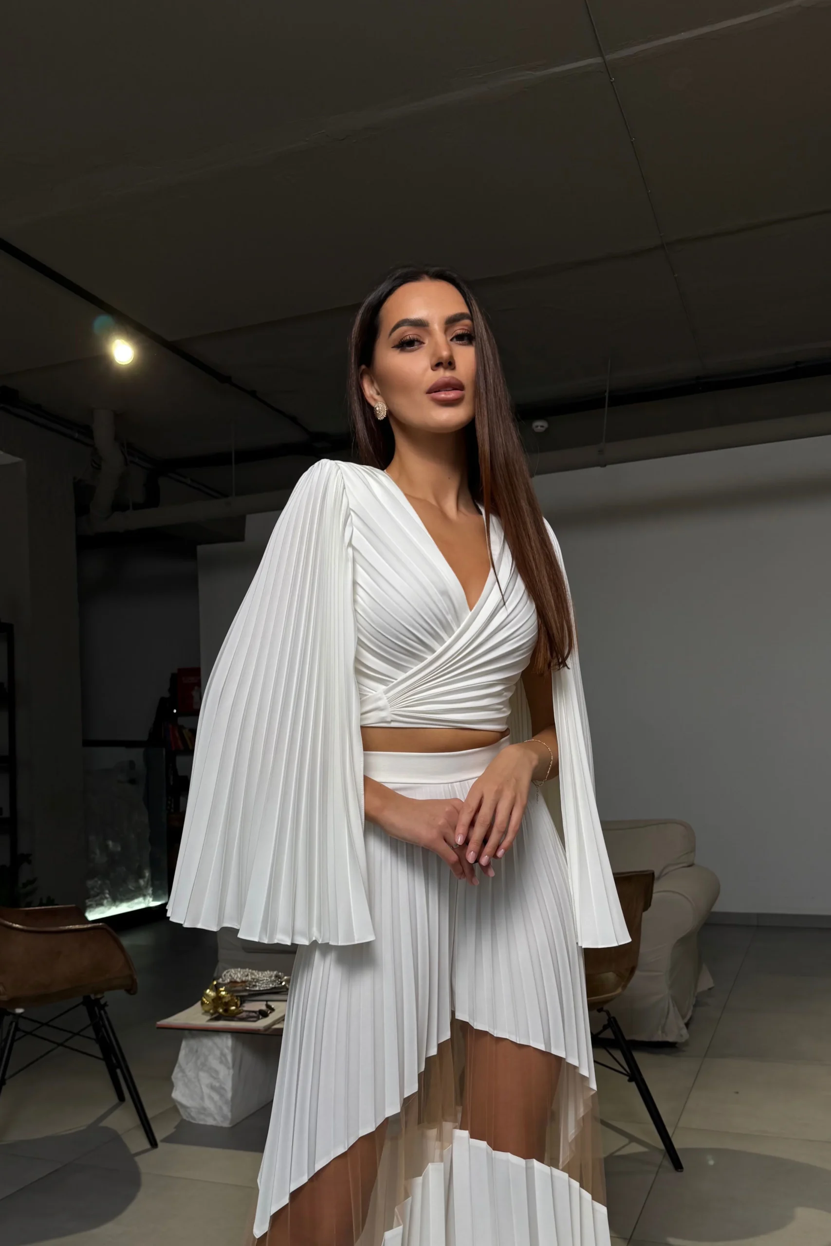 Women’s designer blouse with sculptural shoulder silhouette by REPULO’S