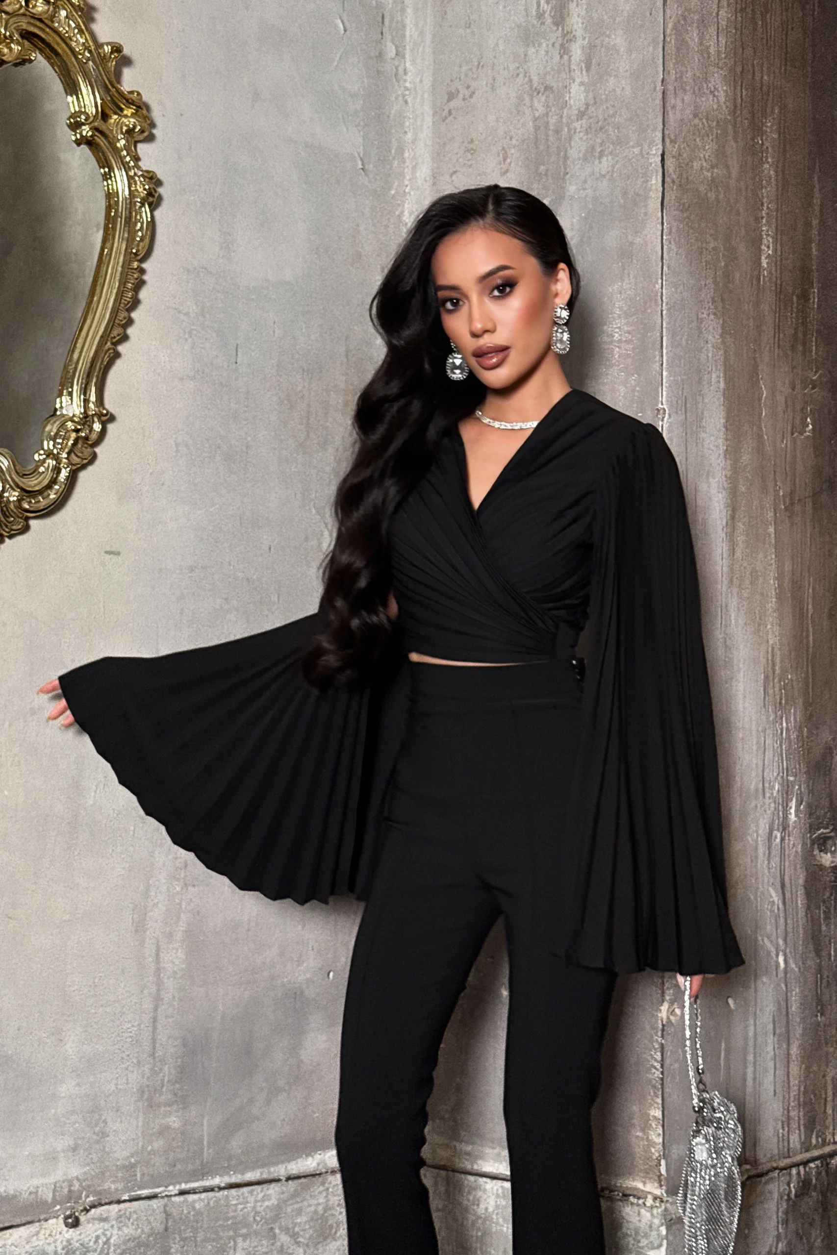 Women’s black wrap blouse with flowing pleated sleeves by REPULO’S