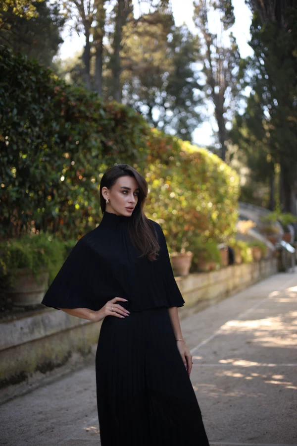 Modern pleated cape with minimalist silhouette by REPULO’S