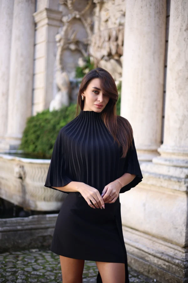 Pleated black cape with elegant turtleneck by REPULO’S