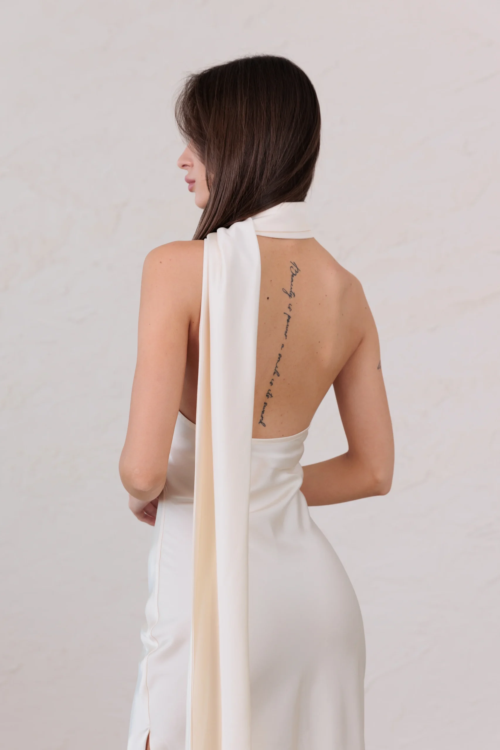 Women’s elegant halter neck dress with half open back by REPULO’S