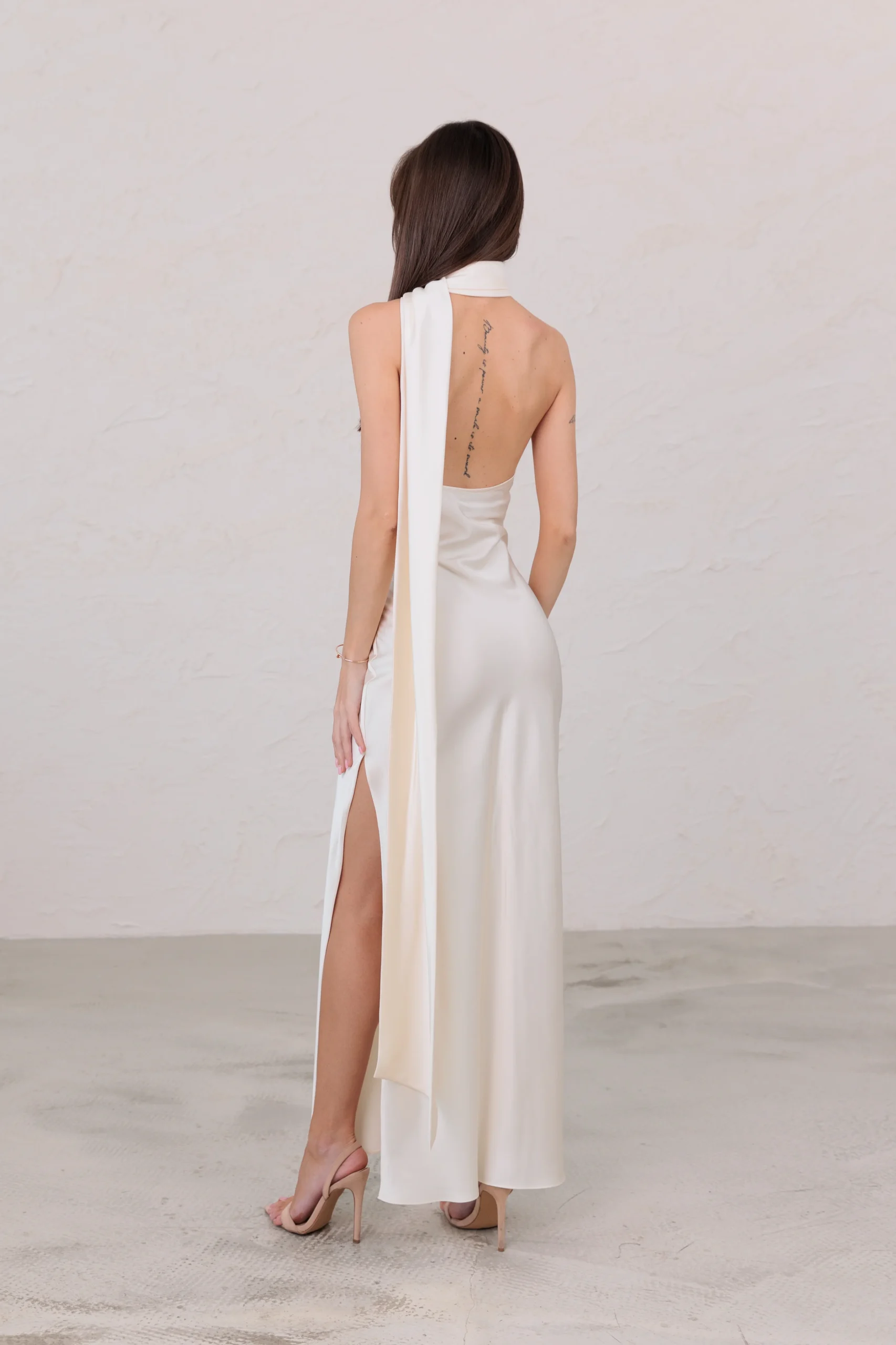 Luxury satin maxi dress with graceful open-back design by REPULO’S