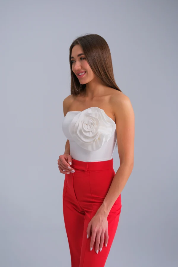 Designer strapless bustier with sculptural floral detail by REPULO’S