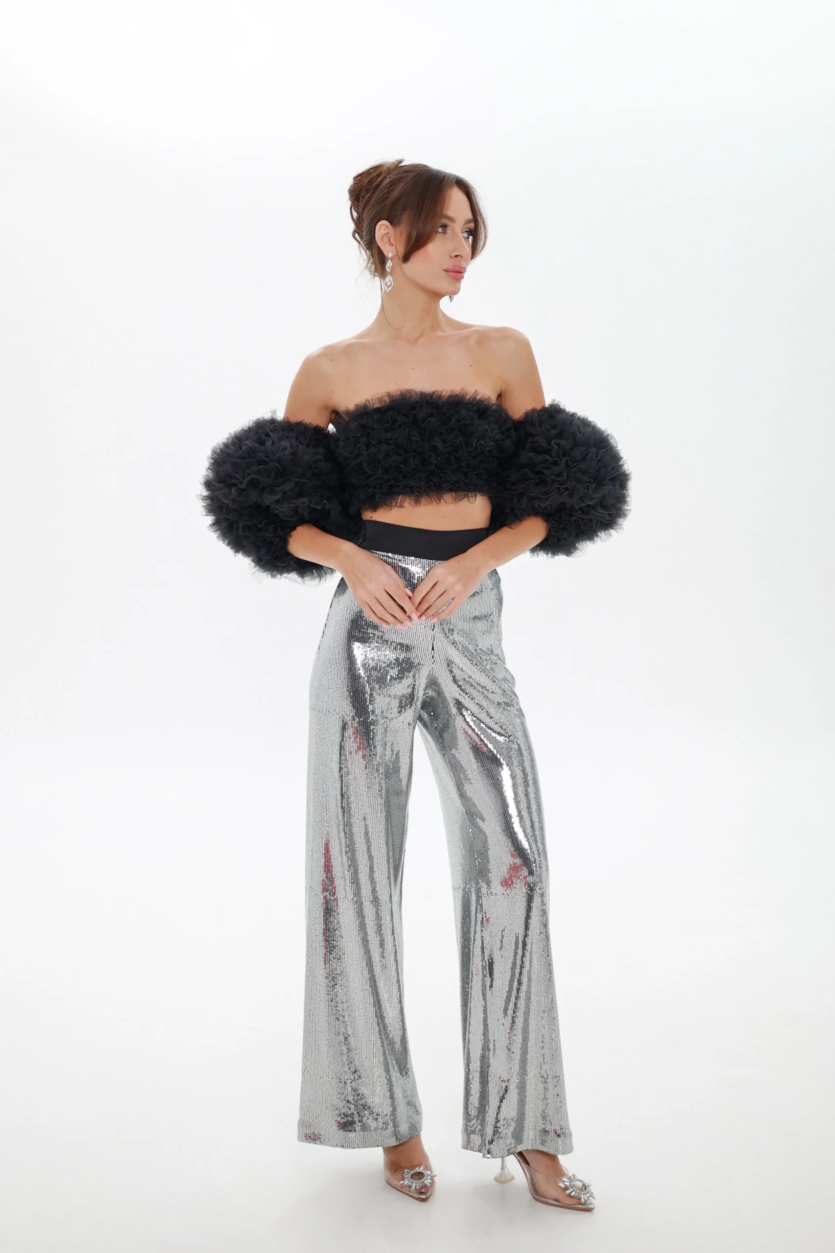 Model wearing the black Cloud top with detachable sleeves, full-length look