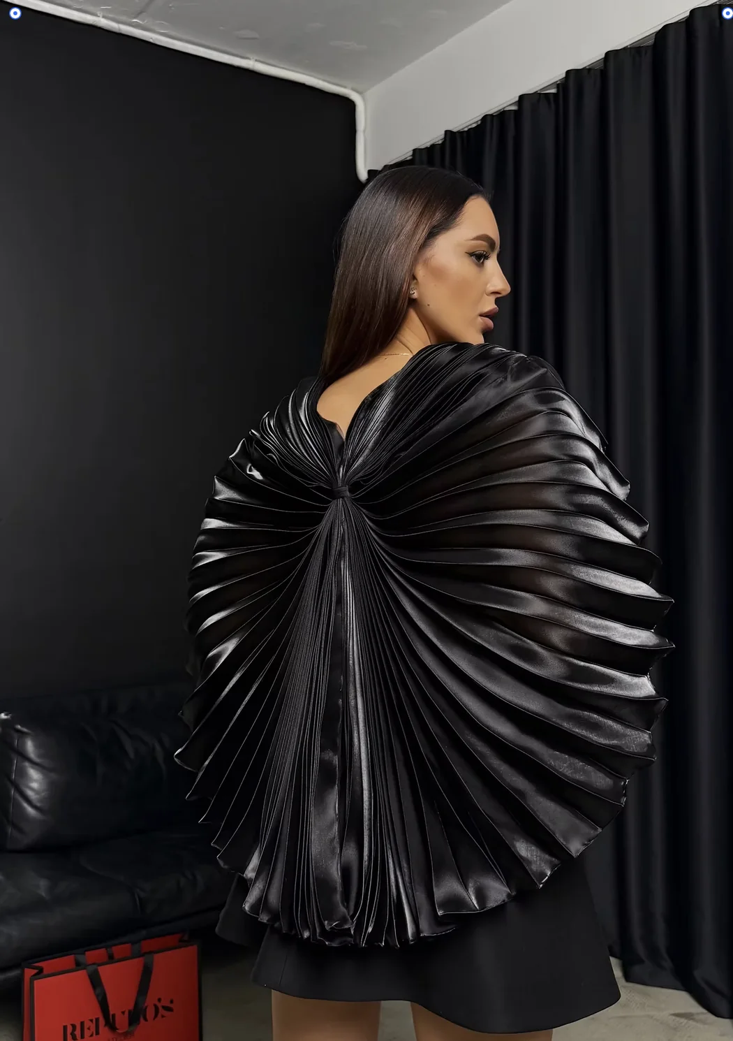 Dramatic pleated cape to layer over a concert dress — REPULO'S detail