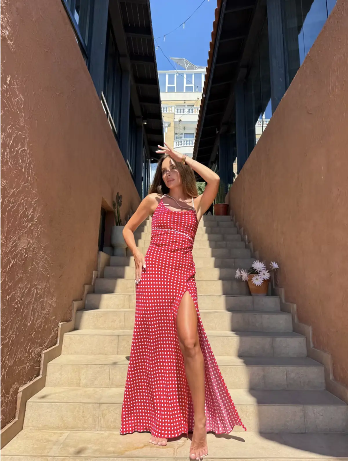 Red polka-dot summer evening dress Kola by REPULO'S on spaghetti straps with a high slit
