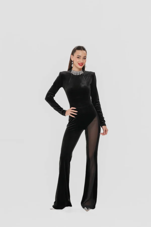 Model wearing the Mila velvet jumpsuit with the crystal necklace