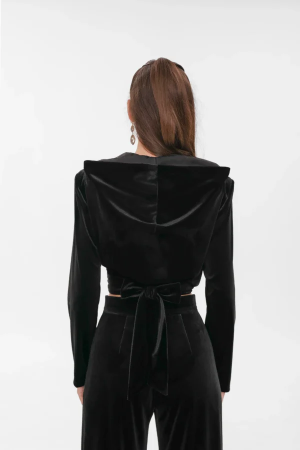 Back detail of the velvet wrap top with the waist tie fastened in a bow