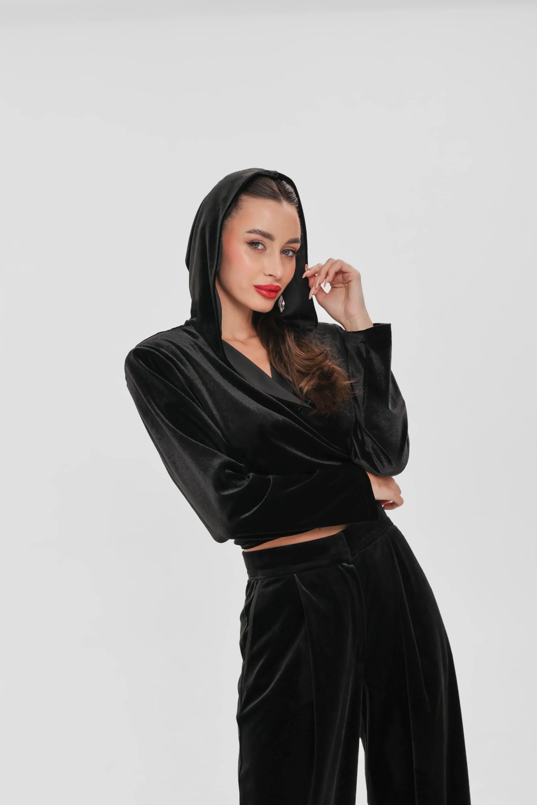 Cropped velvet top with long sleeves and the hood up, three-quarter view by REPULO’S