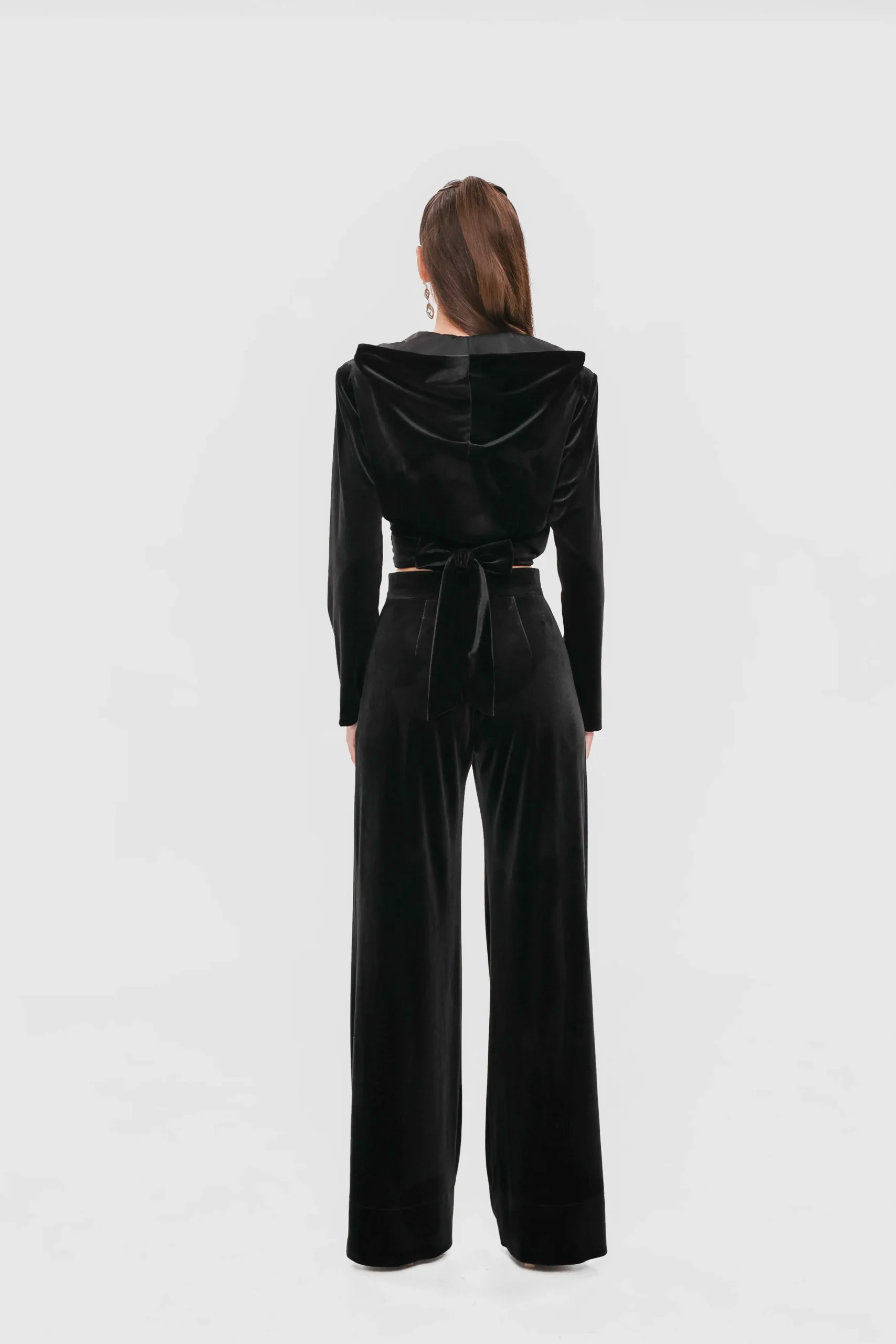 Back view of the velvet wrap top showing the hood and the tie waist
