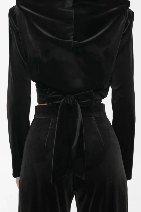 Close-up of the hood and shoulder construction seen from the back, velvet wrap top