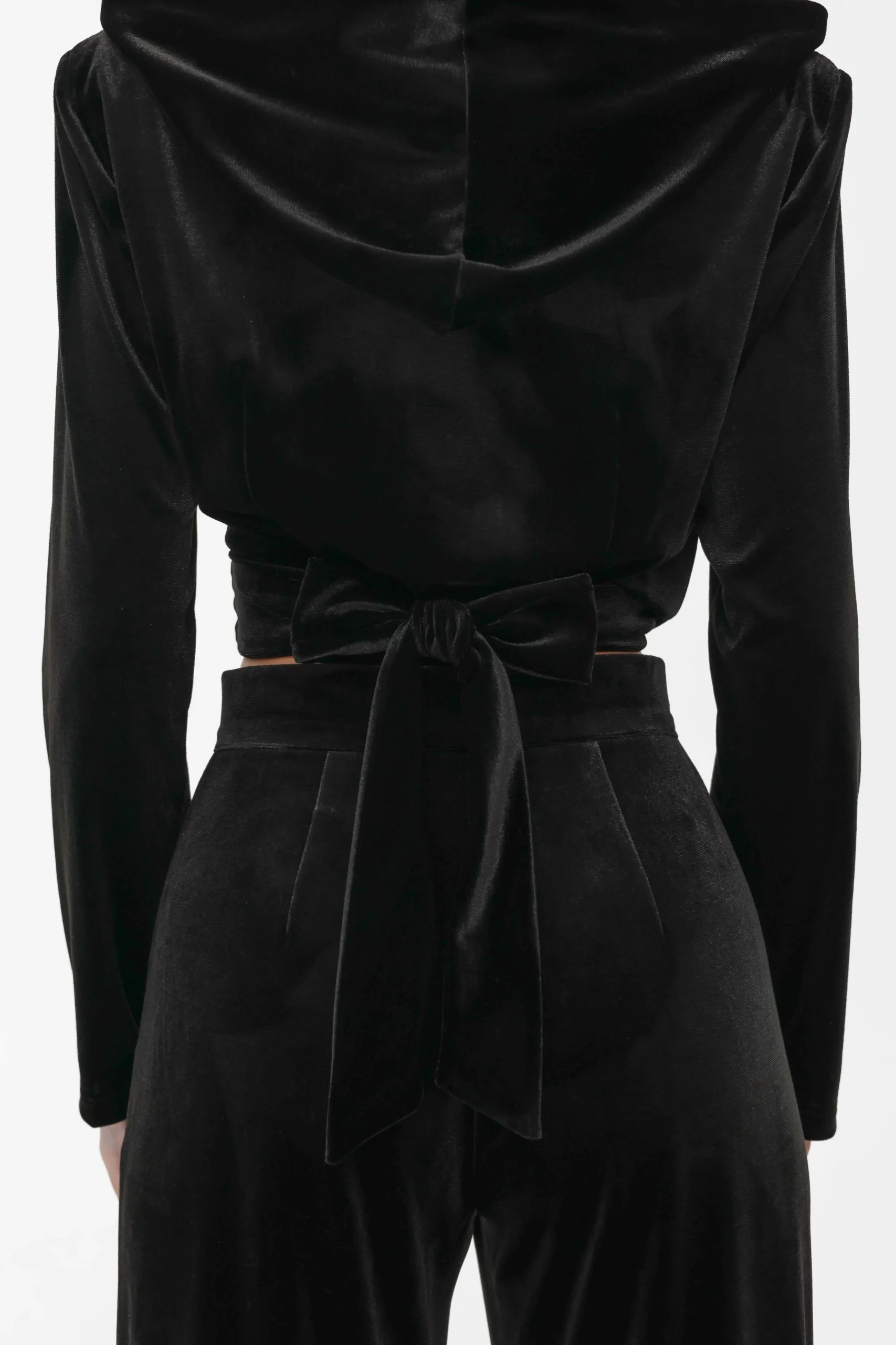 Close-up of the hood and shoulder construction seen from the back, velvet wrap top