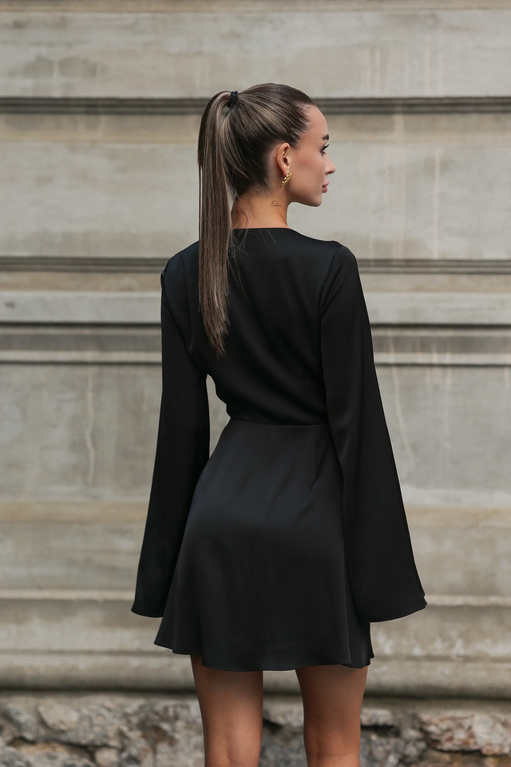 Black A-line mini dress with long, slightly flared sleeves, REPULO’S