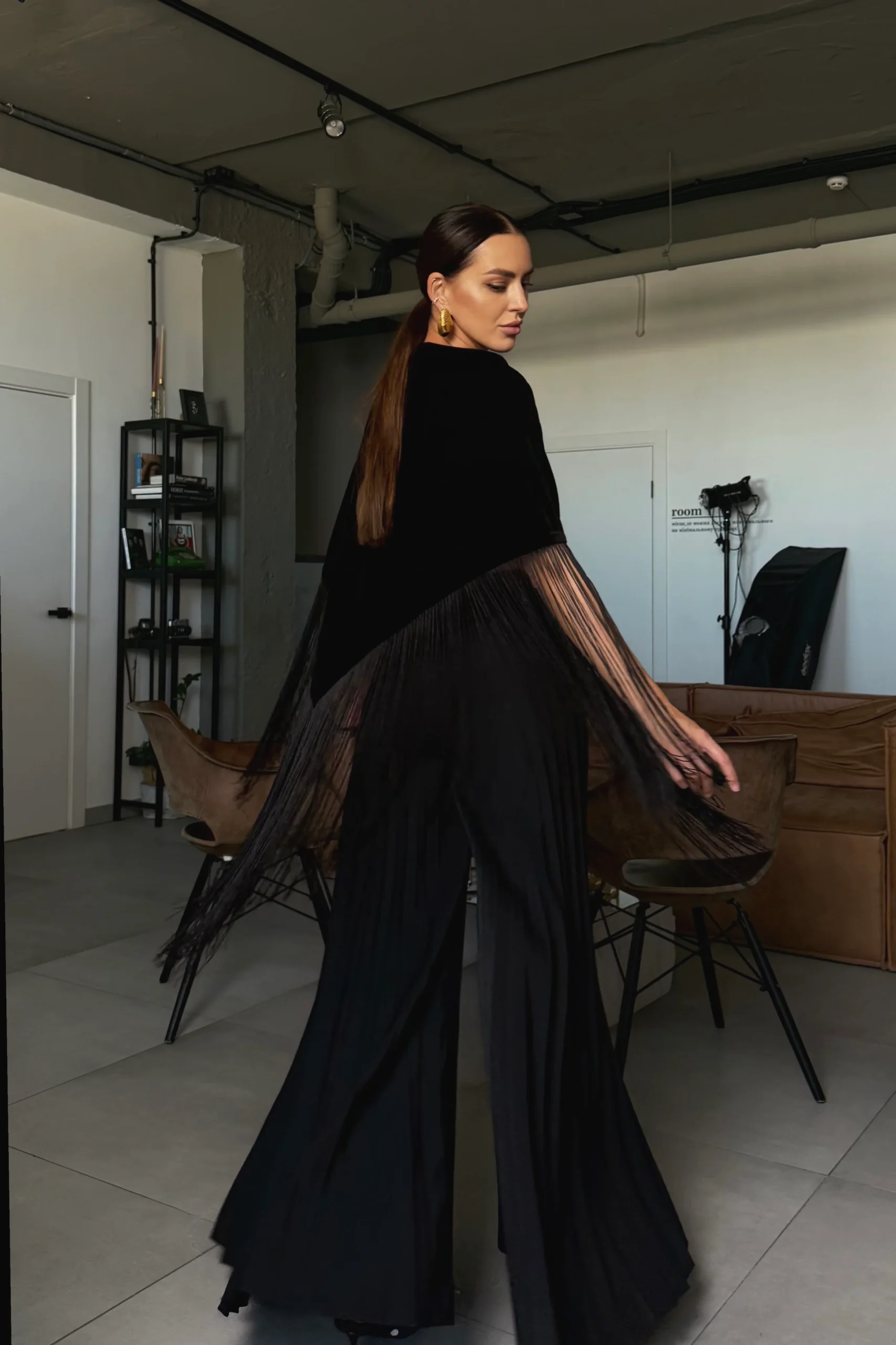 Large black velvet triangle scarf worn over a dress, REPULO’S