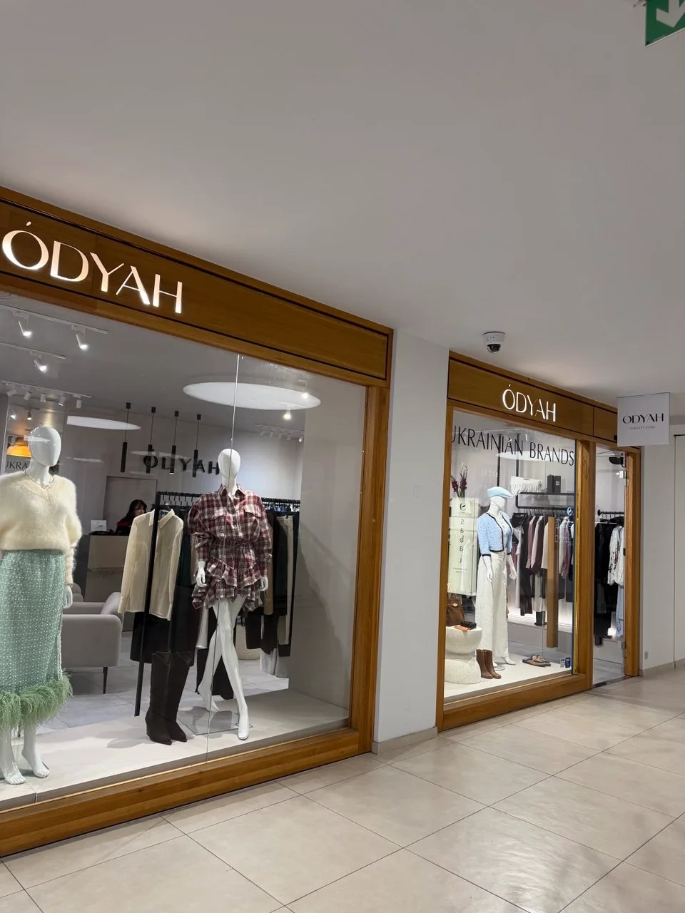 Two windows of the ÓDYAH boutique in the Slovanský dům arcade on Na Příkopě street, Prague