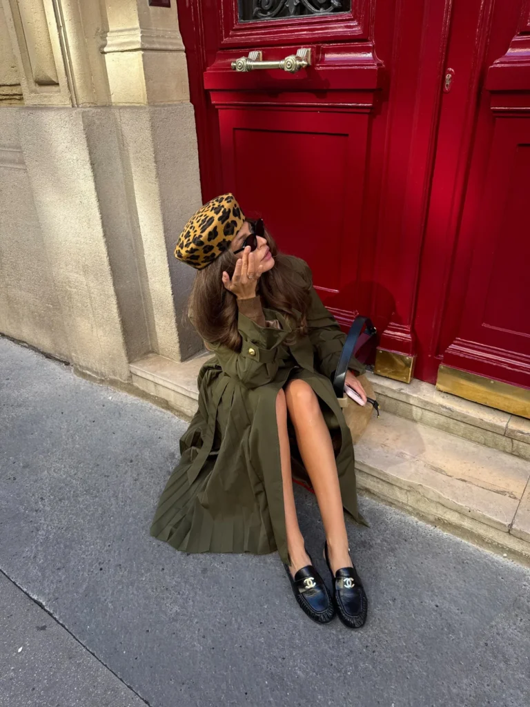 Khaki Amber maxi trench coat with black loafers by red doors