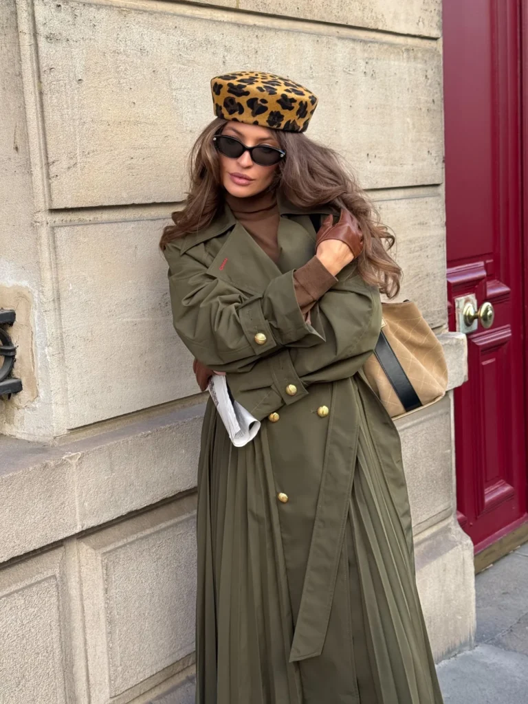 Leopard pillbox hat, black sunglasses and khaki Amber trench coat with a chocolate turtleneck