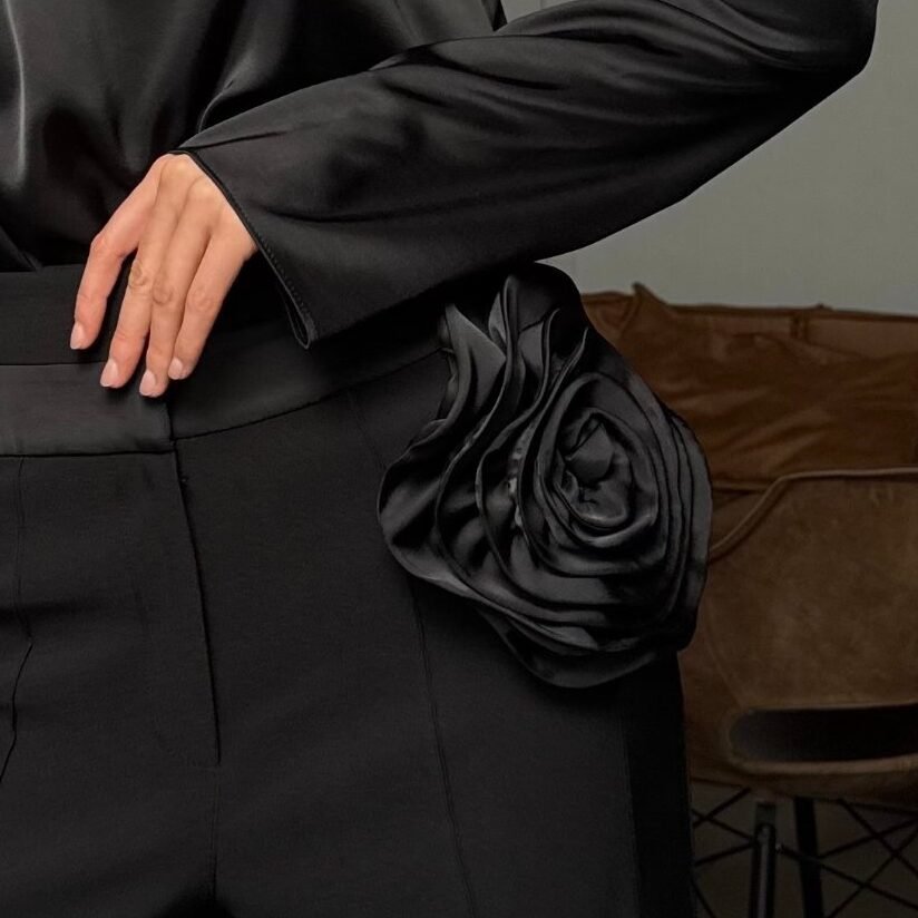 Handmade sculptural satin flower on the waistband of Rosalie trousers by REPULO'S