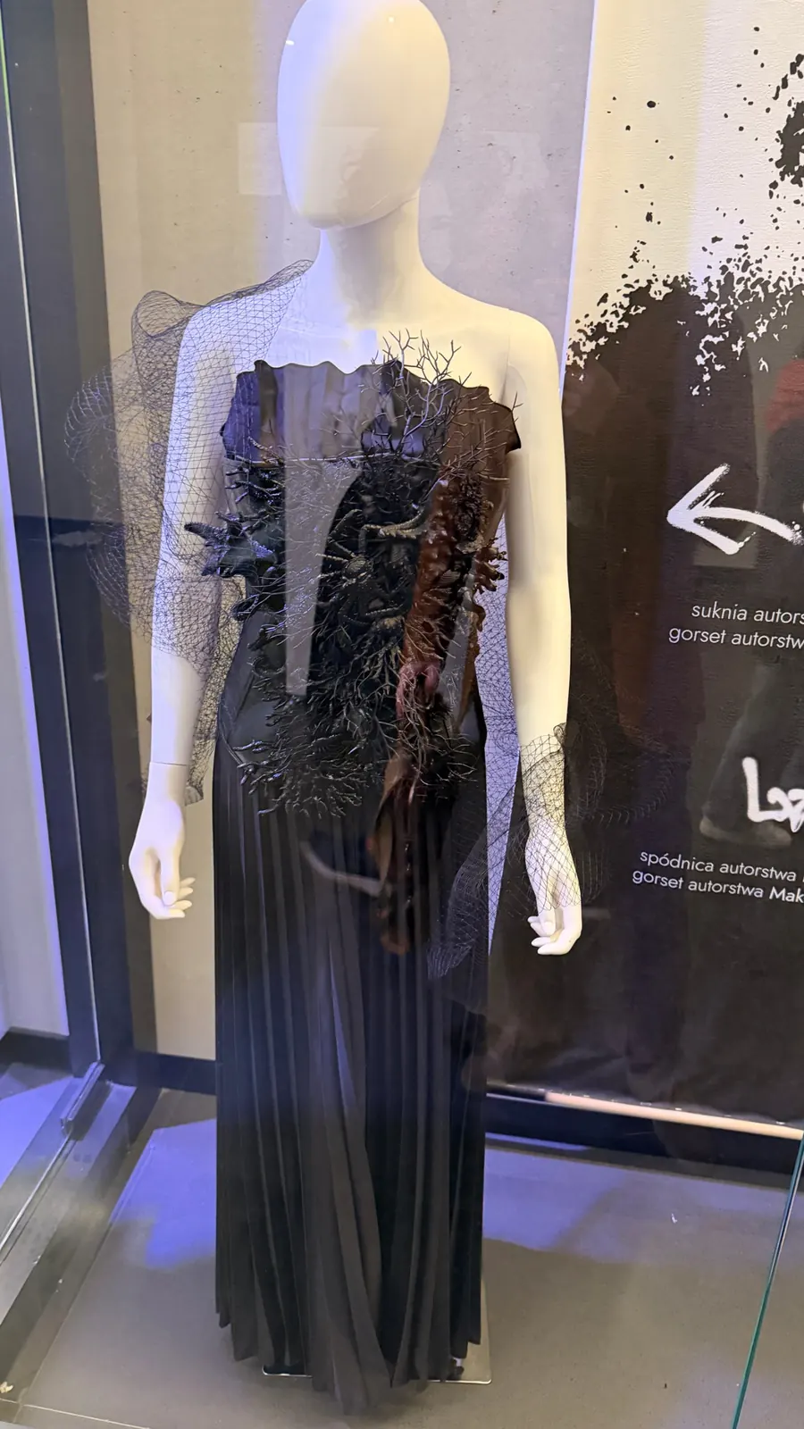 REPULO'S Shell pleated strapless maxi gown from the Siren look in the Bad Girls exhibition showcase at Varso, Warsaw